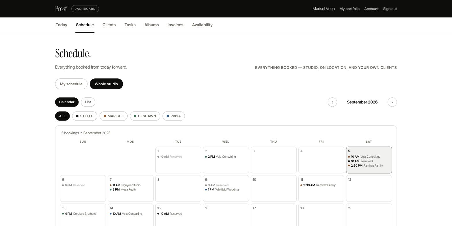 The Proof schedule — whole-studio month view with every photographer's bookings color-coded, filter chips per photographer, and external room holds marked Reserved